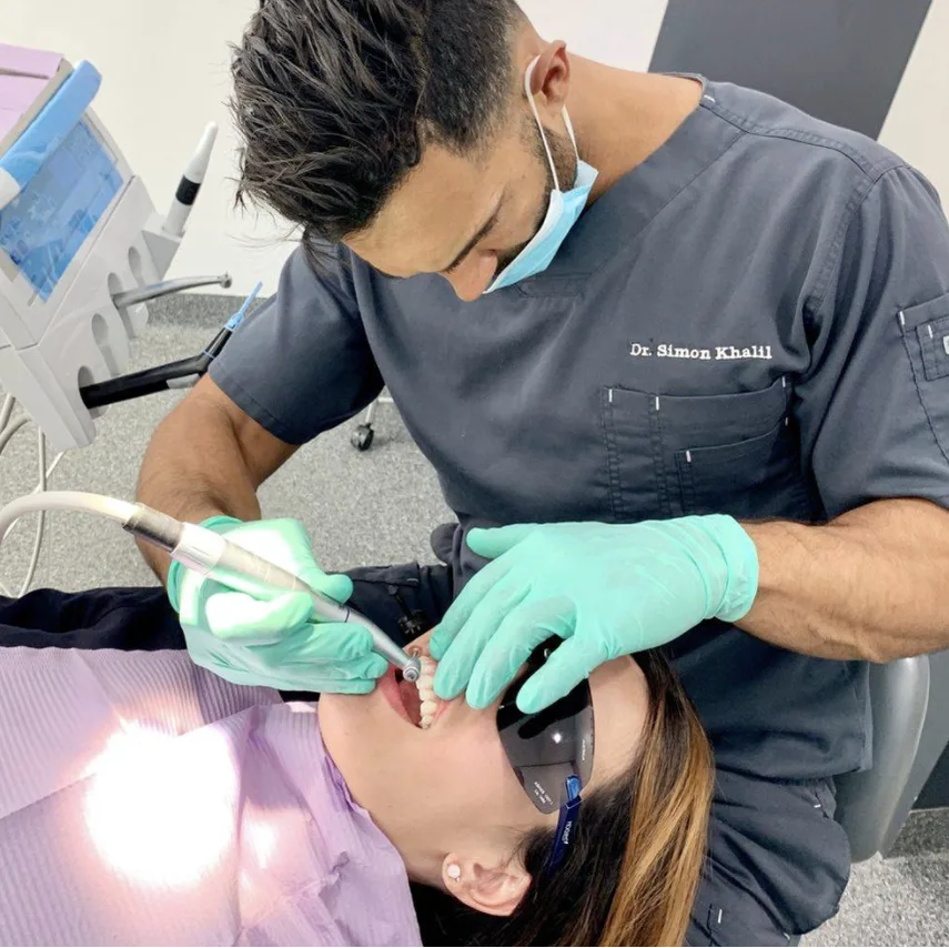 Dentist treating a patient in the chair at Dental Residence Marrickville