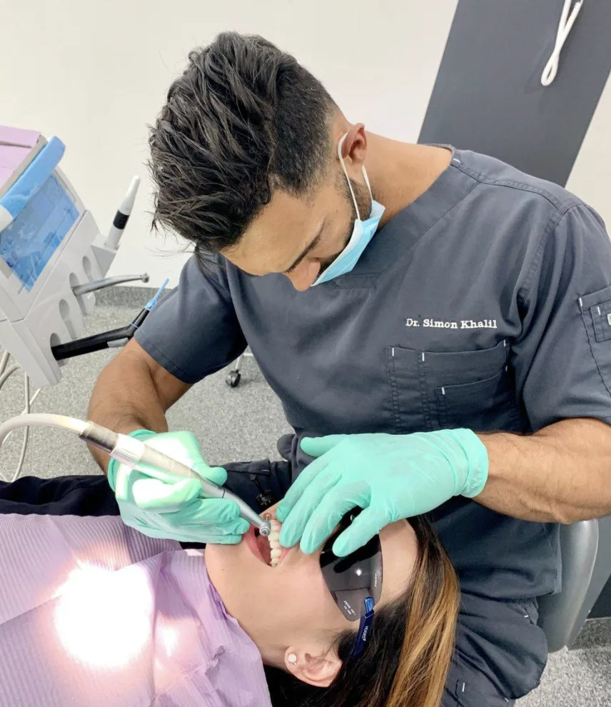 Dentist treating a patient in the chair at Dental Residence Marrickville